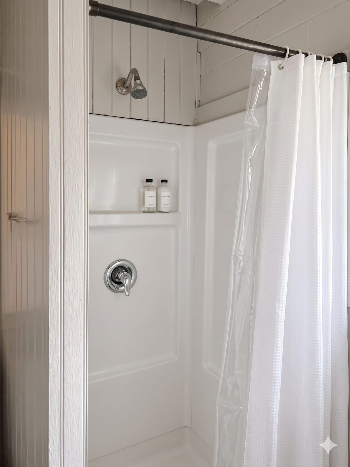 The Architect’s Suite — private bathroom with walk-in shower and white tile surround