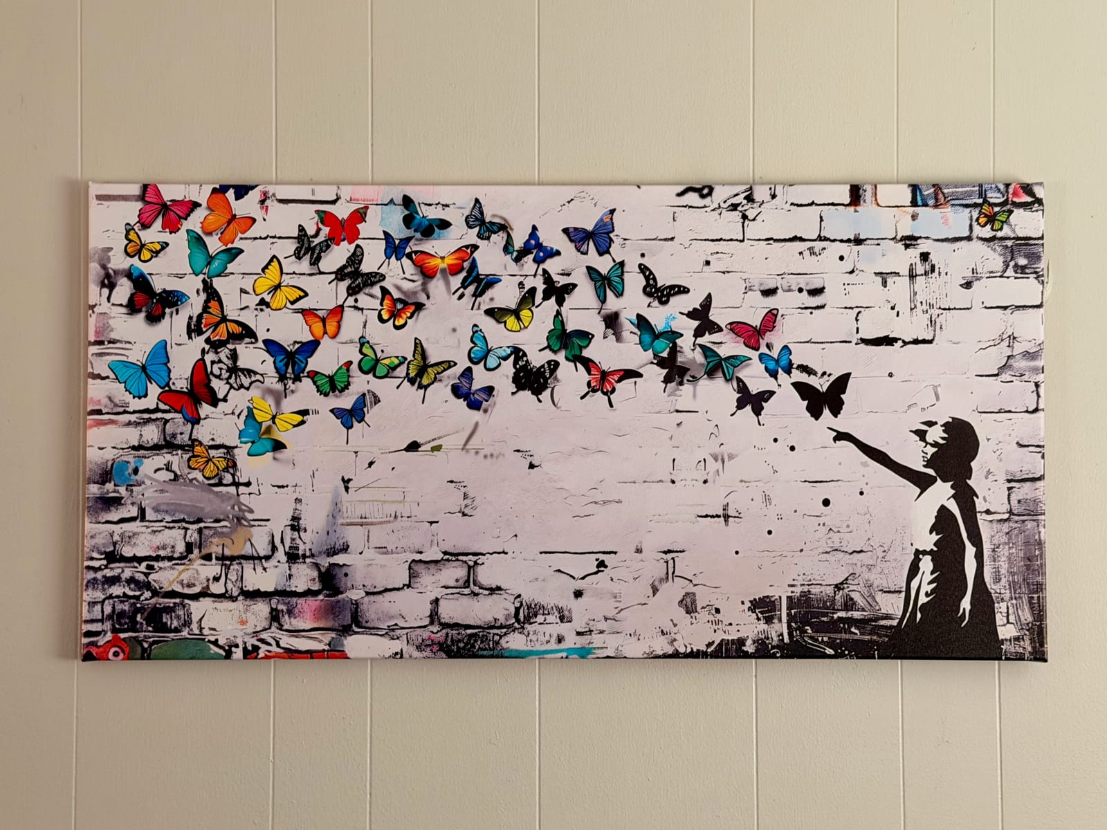The Garden Room — vibrant butterfly mural canvas featuring colorful butterflies on a brick wall background
