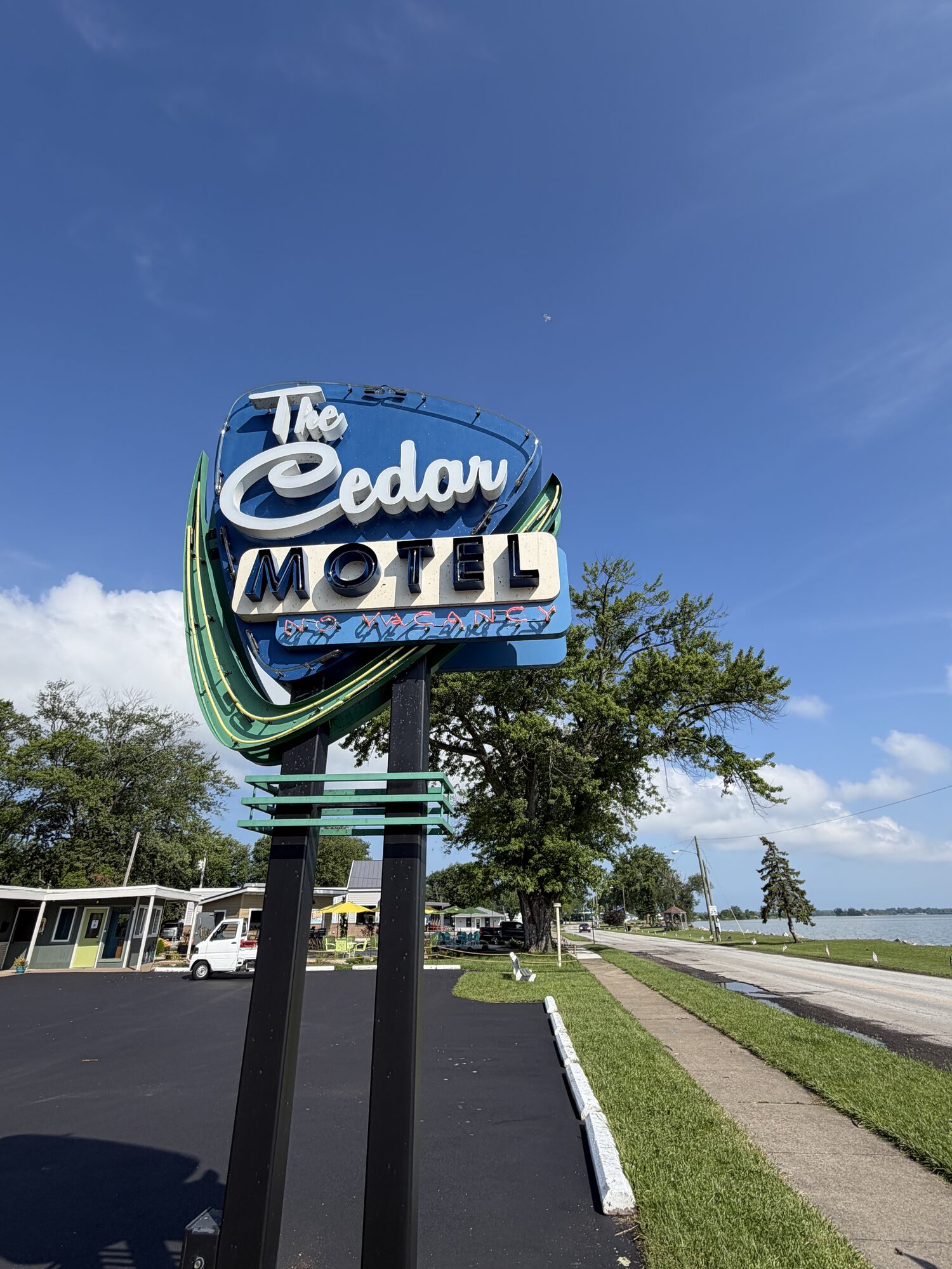 The Cedar's vintage neon sign on East Bayview Drive — look for it and you've found Tique's