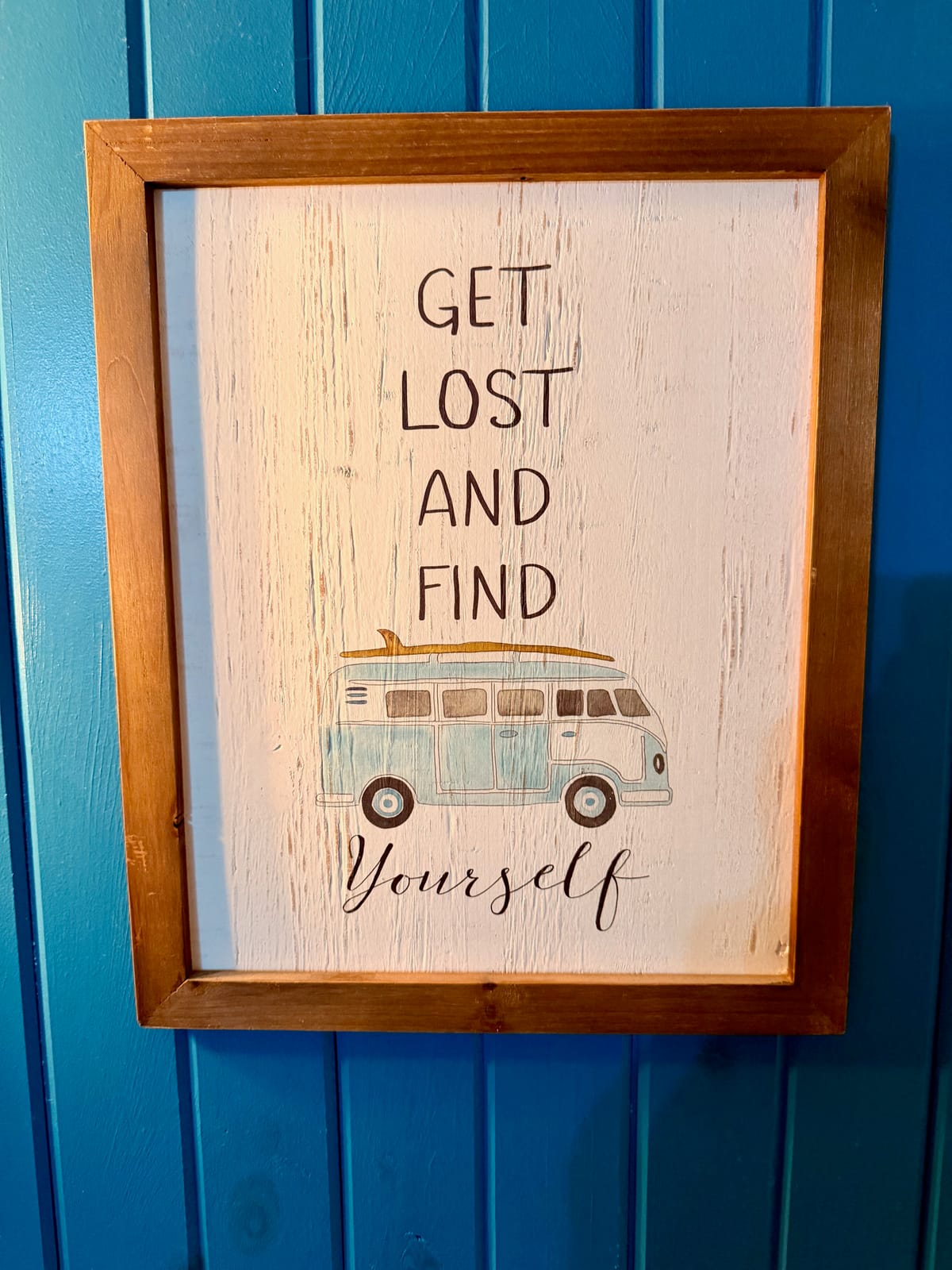 The Traveler's Den — framed Get Lost and Find Yourself wood-plank art print featuring a vintage VW bus